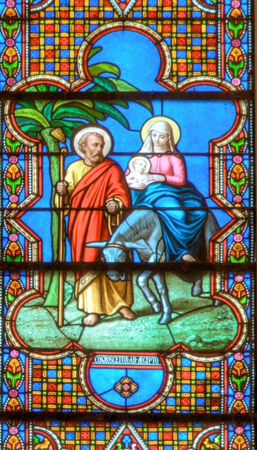 The Flight into Egypt: Mary and the Child on a donkey led by Joseph.